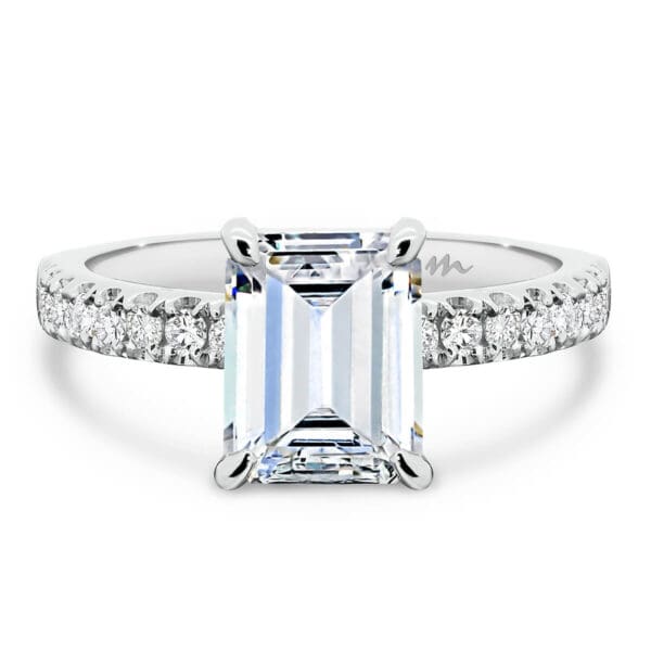 Janet Emerald 7x5-8x6 Moissanite ring with 4-prong basket setting on delicate prong set half band