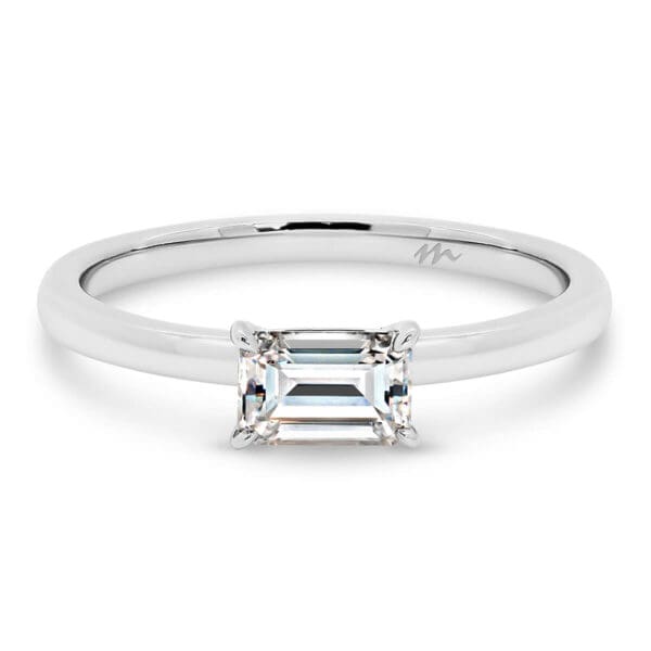 Jolie Emerald Cut 6x4 solitaire Moissanite ring with East-West stone on fine plain band