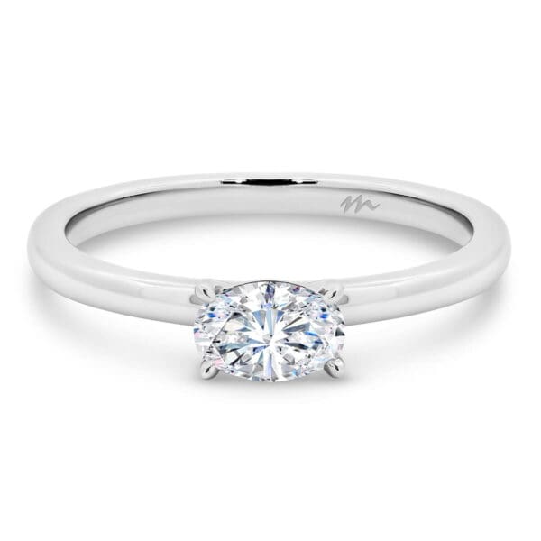 Jolie Oval Solitaire Moissanite Engagement Ring With East-West Stone On Fine Plain Band