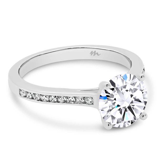London 4 claw round moissanite ring with channel set band
