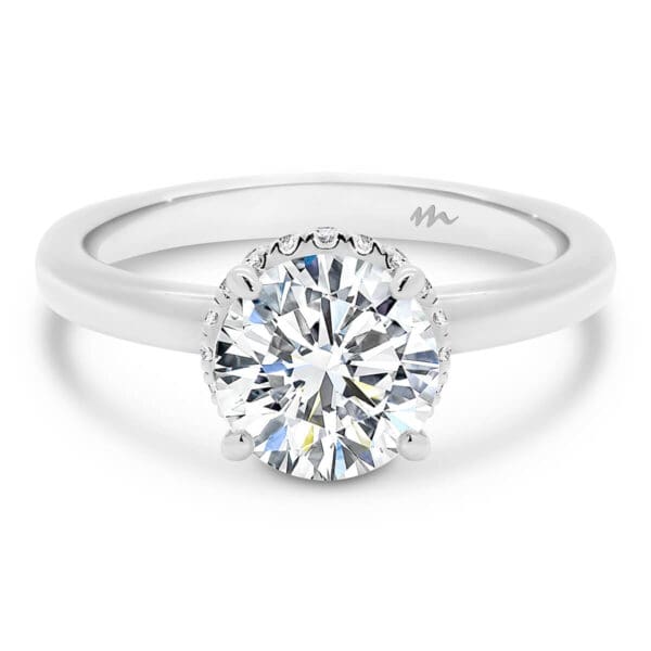 Nadia Round 7.5-8.0 Moissanite Engagement Ring With Solitaire Stone And Encrusted Hidden Halo Wraps Around Claws