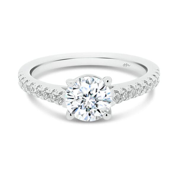 Nouvelle 6.5-7.0 Moissanite Ring With A Crossover Prongs And A Thin Prong Set Band.