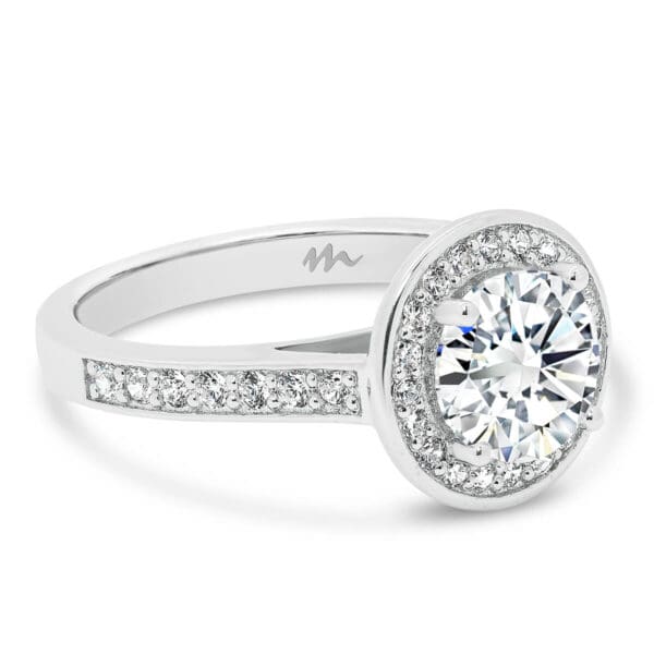 Simona Round 7.5-8.0 halo Moissanite ring with pave halo and matching band.