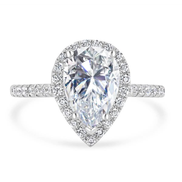 Faith ring with a large pear Moissanite in a halo design and diamond encrusted stones.