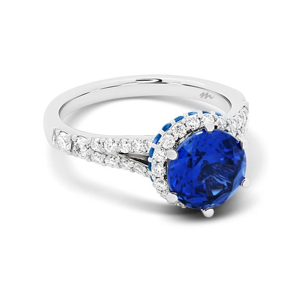 Aster Round Blue two-tone ring with round-cut blue sapphire on stacked halo & split shank