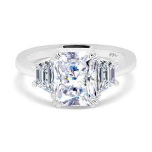 Radiant cut trilogy engagement ring with trapezoid side stones