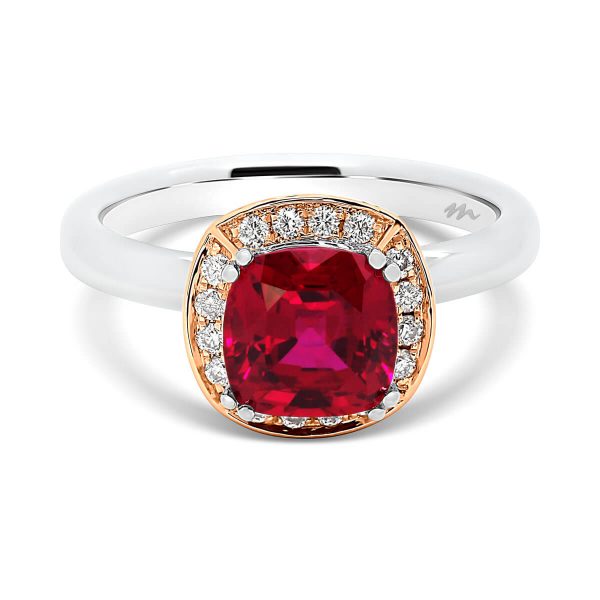 Cedar cushion ruby ring on cushion-shaped halo with ruby accent side stones on rounded plain band