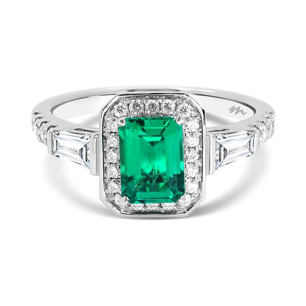 Heather emerald-cut halo ring with emerald centre stone and tapered baguette side stones on prong set band