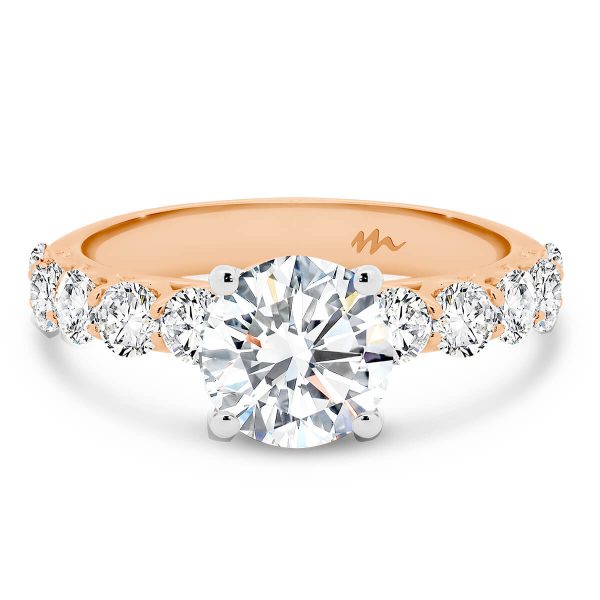 Maxine 7.5-8.0 Moissanite engagement ring with pave-set under-rail and prong set stones on the band