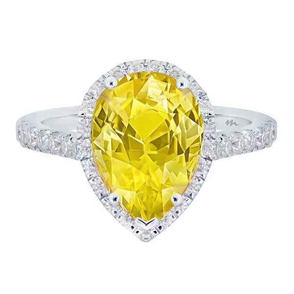 Faith pear cut Yellow Moissanite ring with delicate halo and bridge on prong set band