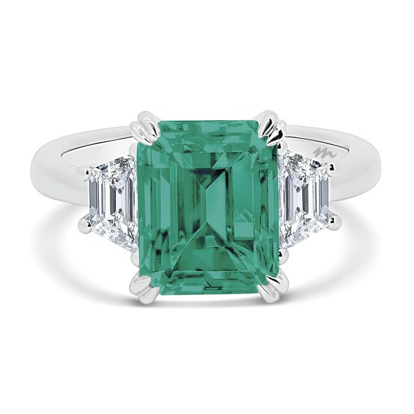 Aubrey Emerald 9x7 Green trilogy with trapezoid stones on a plain band