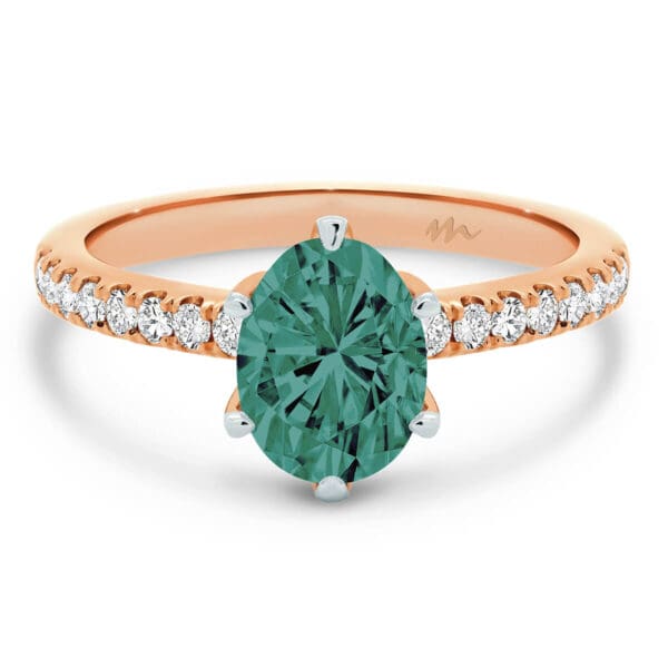 Victoria Oval 9X7 Green Ring On Dainty Band And Green Centre Stone