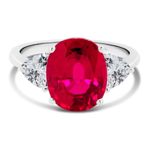 Bluebell ruby trilogy with two trillion cut moissanite side stone on plain band