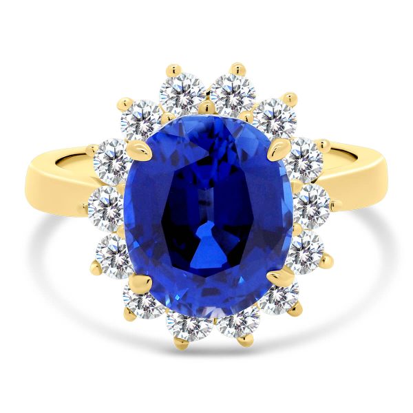 Diana 11x9 halo ring with sapphire centre stone on a plain band