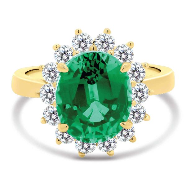 Diana 11x9 halo ring with emerald centre stone on a plain band