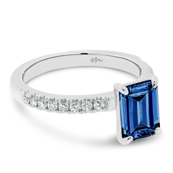 Janet Emerald 9x7 Blue ring with 4-prong basket on micro pave band