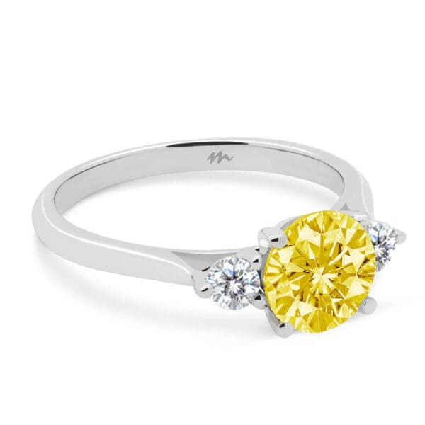 Lawnton 7.5 Yellow 4 prong trilogy ring on a fine knife-edge band