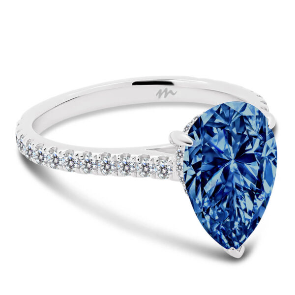 Skylar 10x7 Blue pear cut with micropave under-rail on delicate 3/4 prong band