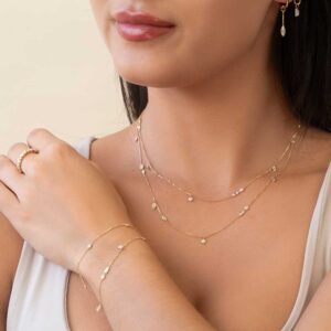 Model Wears Yellow Gold Lou Charm Jen Marquise Cherie Layered Bezel Necklace Eliza Diamond Miley Mixed Cuts Bracelet Cropped