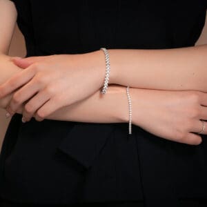 Model Wears Bernadine 2.0 White Gold Diamond Prong Tennis Bracelet Josefina Alternating Large Small Twin Rounds Bracelet