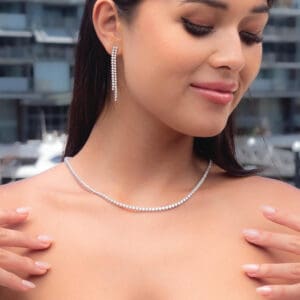 Model wears Leah 2.5 white gold Lab Grown Diamond 3 prong adjustable tennis necklace