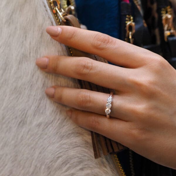 Model Wears Emily 4.0 Rose Gold Diamond Prong Set Equal 3 Stone Trilogy Band Ring
