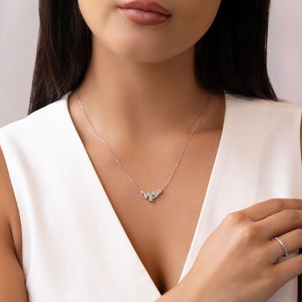 Model Wears Isla Round White Gold Lab Grown Diamond V Shaped Mixed Round Cluster Necklace