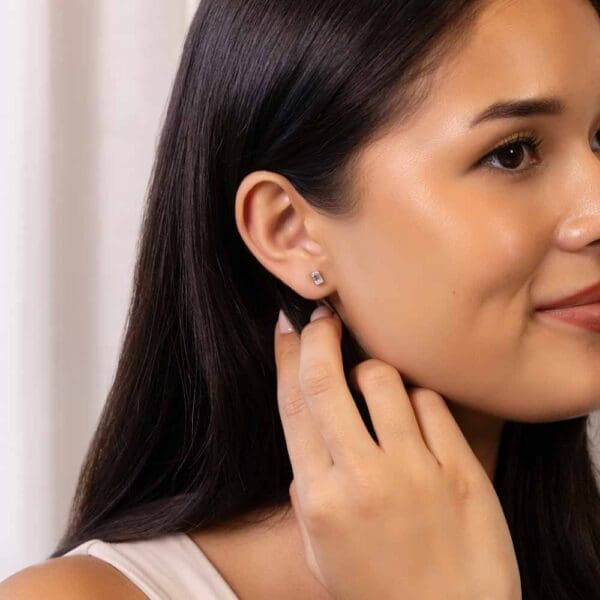 Model Wears Karla Emerald 5X3 White Gold Moissanite Prong Stud Earrings