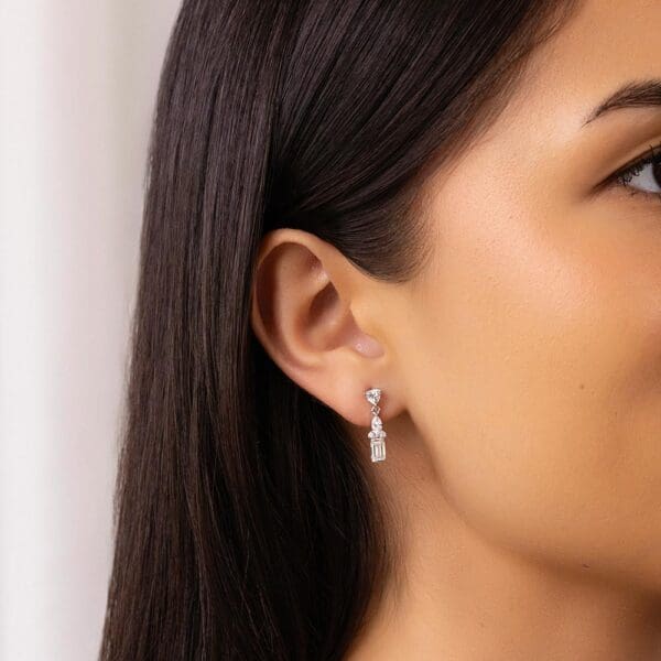 Model Wears Kiana White Gold Lab Grown Diamond Trillion Marquise Emerald Drop Earrings