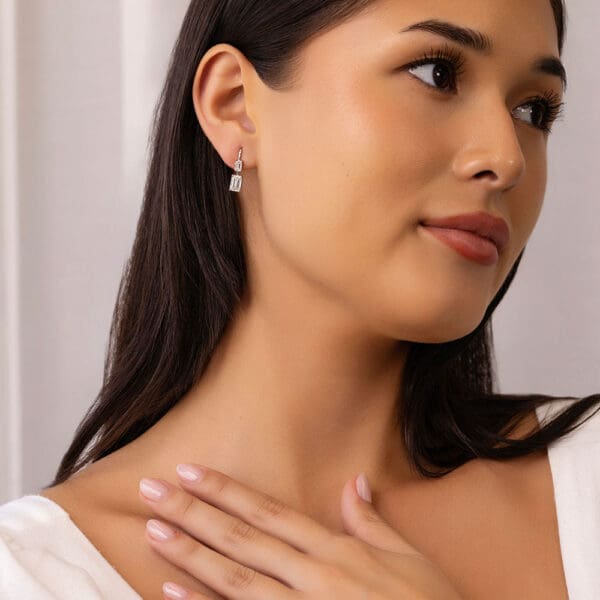 Model Wears Leona White Gold Lab Grown Diamond Double Emerald Cut Drop Earrings