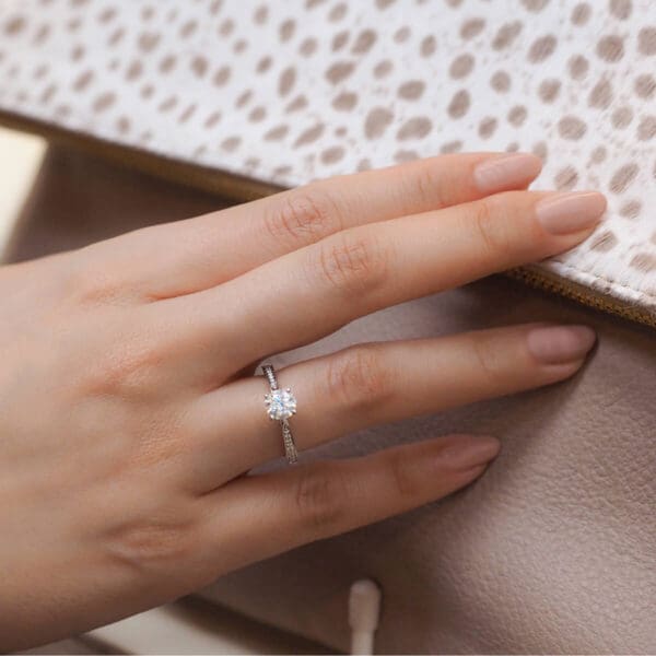 Model Wears Montana 6.0 White Gold Diamond 4 Prong Round Tapered Pave Band Ring