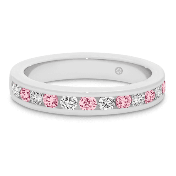 Model wears Carmen 2.0 white gold alternating pink Diamond channel set wedding band Audrey 7.5 Moissanite solitaire ring