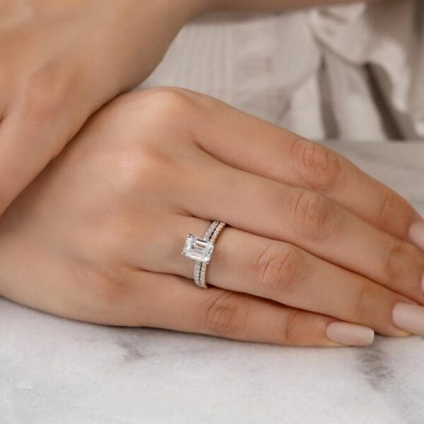 Model Wears Angela 1.3 Rose Gold Diamond U Prong Half Set Band Rosewood Emerald 9X7 White Gold Moissanite Open Basket Ring