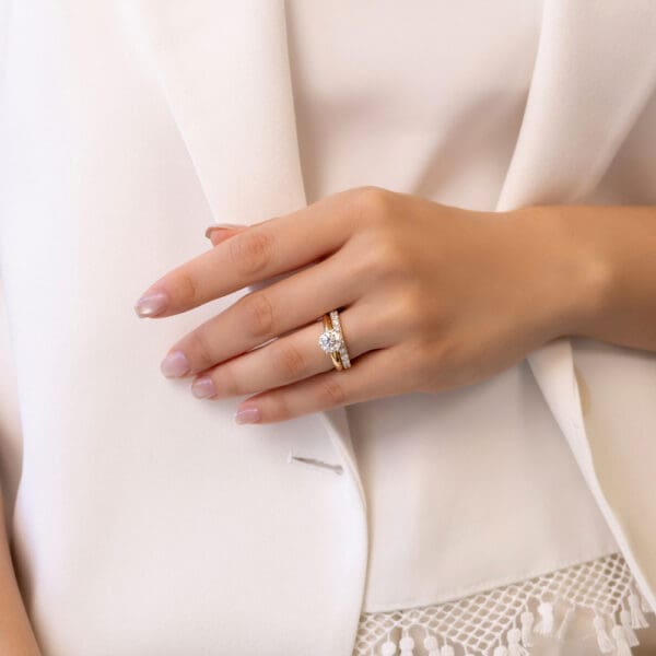 Model Wears Angela 2.5 Yellow Gold Diamond U Prong Half Set Wedding Band Audrey 7.5 Six Prong Knife Edged Solitaire Ring