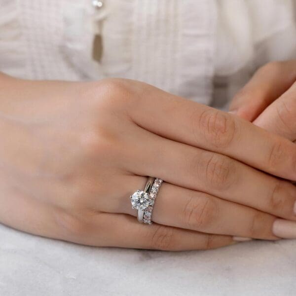 Model Wears Angelica 2.5 White Gold Alternating Pink Diamond U Prong Set Wedding Band Audrey 7.5 Moissanite Solitaire Ring