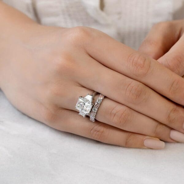 Model Wears Angelica 3.0 White Gold Alternating Pink Diamond U Prong Band Aubrey Radiant Moissanite Double Prong Trilogy Ring