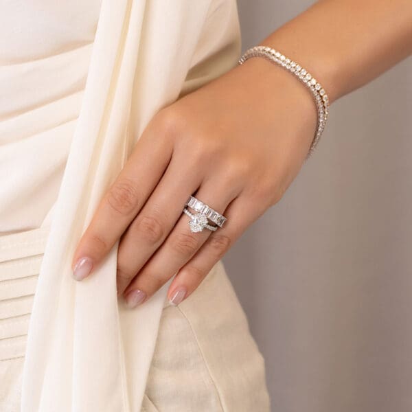 Model Wears Astrid Emerald 5X3 White Gold Diamond Half Eternity Wedding Band Rosewood Oval 10X8 Open Basket U Prong Ring
