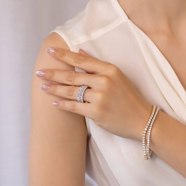 Model Wears Astrid Emerald 5X3 White Gold Diamond Prong Set Half Eternity Wedding Band Kyla Emerald East West Ring