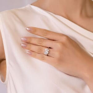 Model Wears Aurelie 11X5.5 White-Gold Moissanite Marquise Pear Cut Toi Et Moi Ring