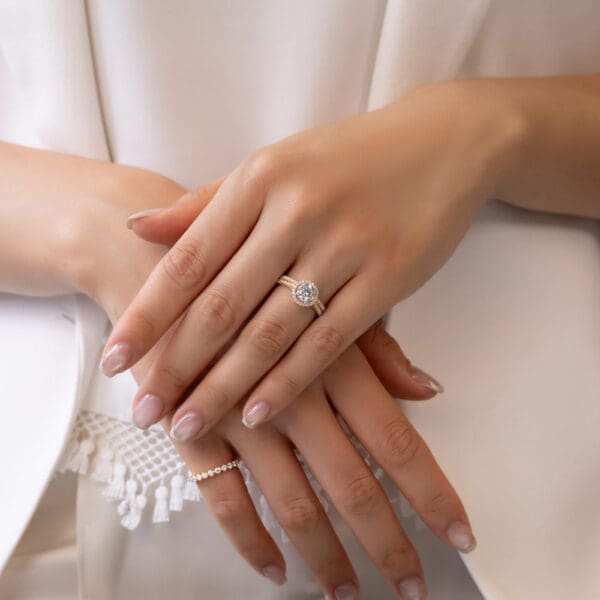 Model Wears Ava A Yellow Gold Diamond Prong Set Wedding Band Ava Round 6.5 Halo Ring