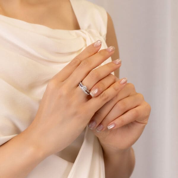 Model Wears Brynn Brynn A White Gold Diamond Straight Channel Set Wedding Ring