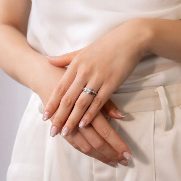 Model Wears Carmen 1.1 White Gold Diamond Channel Set Wedding Band Hattie Round 2.00Ct Under Rail Bridge Stone Set Ring