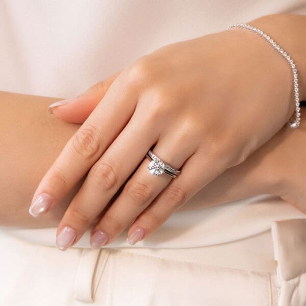 Model Wears Carmen 1.5 White Gold Diamond Channel Set Wedding Band Hattie Round 2.00Ct Under Rail Bridge Stone Set Ring