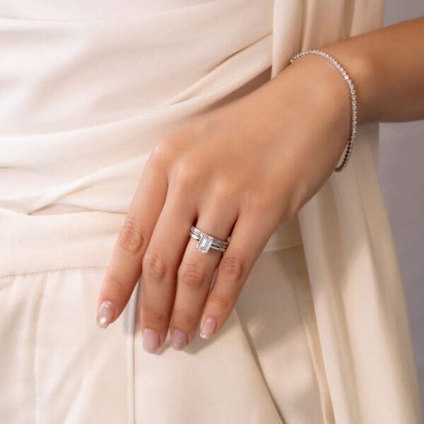Model Wears Carmen 1.7 White Gold Diamond Channel Set Wedding Band Holly Emerald 2.00Ct Solitaire Ring