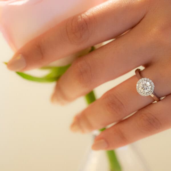 Model Wears Deedee 6.0 White Gold Diamond 6 Prong Pave Solitaire Rounded Band Halo Ring.jpg