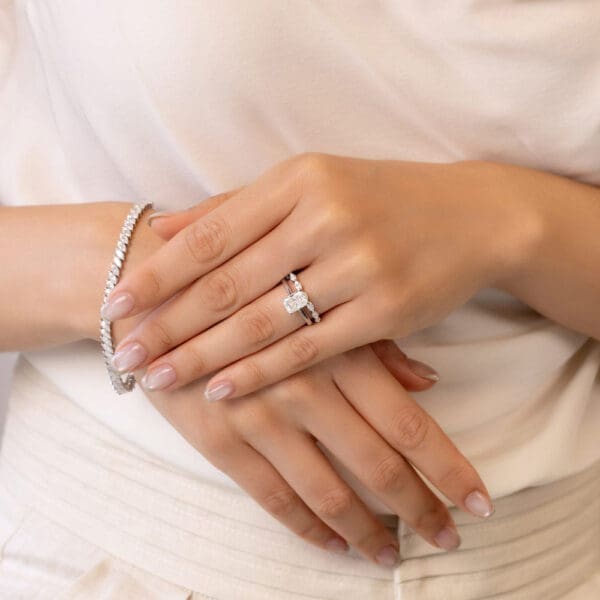 Model Wears Eden White Gold Moissanite Marquise Shared Prong Wedding Band Lydia Radiant 8X6 Solitaire Ring