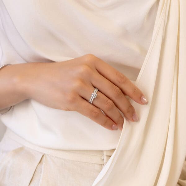 Model Wears Erin A Erin Round 6.5 Angled Yellow Gold Moissanite 4 Prong Under Rail Prong Set Band Ring