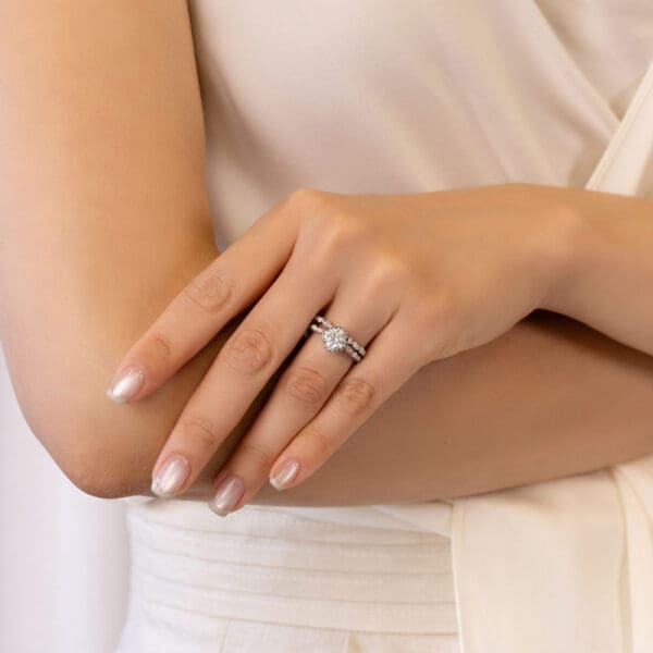 Model Wears Fairlight A White Gold Diamond Bezel Set Round Marquise Pave Wedding Band Fairlight Halo Engagement Ring
