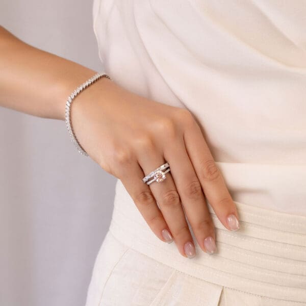 Model Wears Kyla Emerald White Gold Diamond East West Prong Set Wedding Band Balmain Round Pink 2.05Ct Accented Basket Ring
