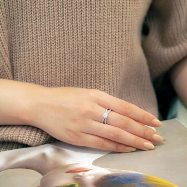Model Wears Livana 5.0 White Gold Diamond 4 Prong Split Crossover Band Ring